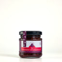 A glass jar of Strawberry and Cinnamon Jam by The Mulberry Pig on a clean white background.