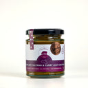 A glass jar of The Mulberry Pig Eggplant, Sultana & Curry Leaf Chutney with a black lid and a purple and white label, set against a plain white background.