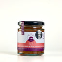 A glass jar of The Mulberry Pig Peach, Chilli and Black Pepper Chutney on a clean white background. The jar has a black lid, a purple and white label, and a purple seal ribbon, with visible chunks of reddish-brown chutney inside.