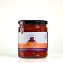 A glass jar of Sweet Chilli Jam by The Mulberry Pig, featuring a black lid and a white and orange label, set against a plain white background.