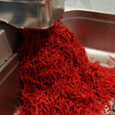 Freshly grated beetroot being processed for small batch relish at The Mulberry Pig