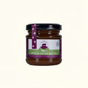 Jar of Apple & Thyme Butter with a purple label on a white background