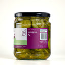 glass jar of The Mulberry Pig bread and butter pickles, showing the back of the label with product details, set against a clean light gray background.