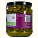 Jar of pickles with a purple label on a white background