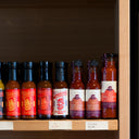 The Mulberry Pig sauces sat next to other products at Mane Liqour