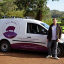 Owner and founder Dom stood with the Mulberry Pig Van at a local orchard in Denmark WA