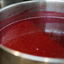 Salted Plum sauce in a small pot for the mulberry pigs Salted plum & Black pepper sauce