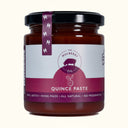 Jar of quince paste with a purple label on a white background