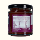 Jar of jam with a nutrition label on a white background