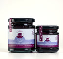 A jar of the mulberry pig blueberry and lavender jam, showing the 2 different sizes  with purple branding and light blue product stripe.