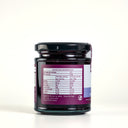 A jar of the mulberry pig blueberry and lavender jam, showing the Nutritional label with purple branding and light blue product stripe.