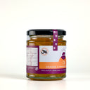 Side of a jar of The Mulberry Pig Orange & Whiskey Marmalade showing the Whipper Snapper Distillery logo on the label, on a plain light background.
