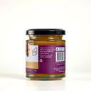 A glass jar of The Mulberry Pig apple pear and ginger chutney with a black lid and a purple label, photographed on a clean white background. The label includes a 'Made in WA' seal and product details.