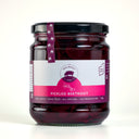 A glass jar of The Mulberry Pig Pickled Beetroot with a black lid and a white, pink, and purple label, set against a plain light gray background.