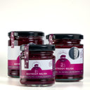 Three glass jars of Beetroot Relish from The Mulberry Pig, arranged on a clean white background. The jars contain a deep red-purple beetroot preserve and are topped with black lids, featuring white and magenta labels with a pig logo and a silver medal from Melbourne royal..