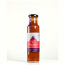 A glass bottle of The Mulberry Pig 
Handmade Chilli Garlic Sauce with Fenugreek, featuring a white and red label with a purple accent ribbon, set against a plain white background.
