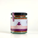 A glass jar of The Mulberry Pig Smoked Chilli Garlic Salt with a black lid and a white and pink label, set against a plain white background.