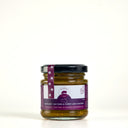A picnic sized glass jar of The Mulberry Pig Eggplant, Sultana & Curry Leaf Chutney with a black lid and a purple and white label, set against a plain white background.