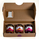 The One For Breakfast gift box from The Mulberry Pig, open to show three jars: Tomato Relish, Sweet Chilli Jam and Raspberry Jam