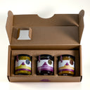 The One For Cheese gift box from The Mulberry Pig, open to show three jars: Piccalilli, Spiced Plum Butter and Apple, Pear & Ginger Chutney