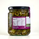 A glass jar of The Mulberry Pig Pickled Jalapeños with a black lid and a white, dark green, and purple label showing nutritional value, set against a plain light grey background.