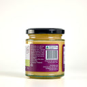 A glass jar of 'The Mulberry Pig' Lemoncello Curd with Gincello, featuring a black lid, a purple and white label with green accents, and a purple paper seal, set against a plain white background.
