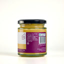 A glass jar of The Mulberry Pig passionfruit Curd, showing the back label with product details, a barcode, and a black lid, set against a plain white background.