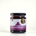 A glass jar of Mulberry Pig Spiced Plum Butter with a black lid, featuring a white and purple label with a Sydney royal 'Gold medal 2024', set against a plain light gray background.