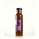 A glass bottle of The Mulberry Pigs  Lightly Spiced BBQ Sauce with a black cap and a purple and white label showing product description
, set against a plain white background.