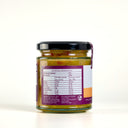 A glass jar of 'The Mulberry Pig' Summer Relish with a black lid, set against a plain white background. The label features white, orange, and purple sections showing the nutritional panel.