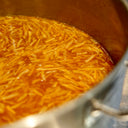 a large pan of orange rind in syrup for the mulberry pigs orange marmalade